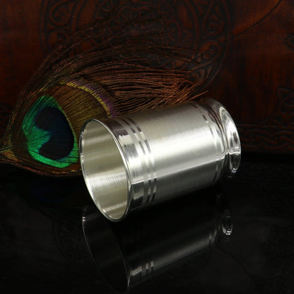 999 fine silver vessel and glass tumbler set by TRIBAL ORNAMENTS, includes silver flask and utensils for babies and kids.