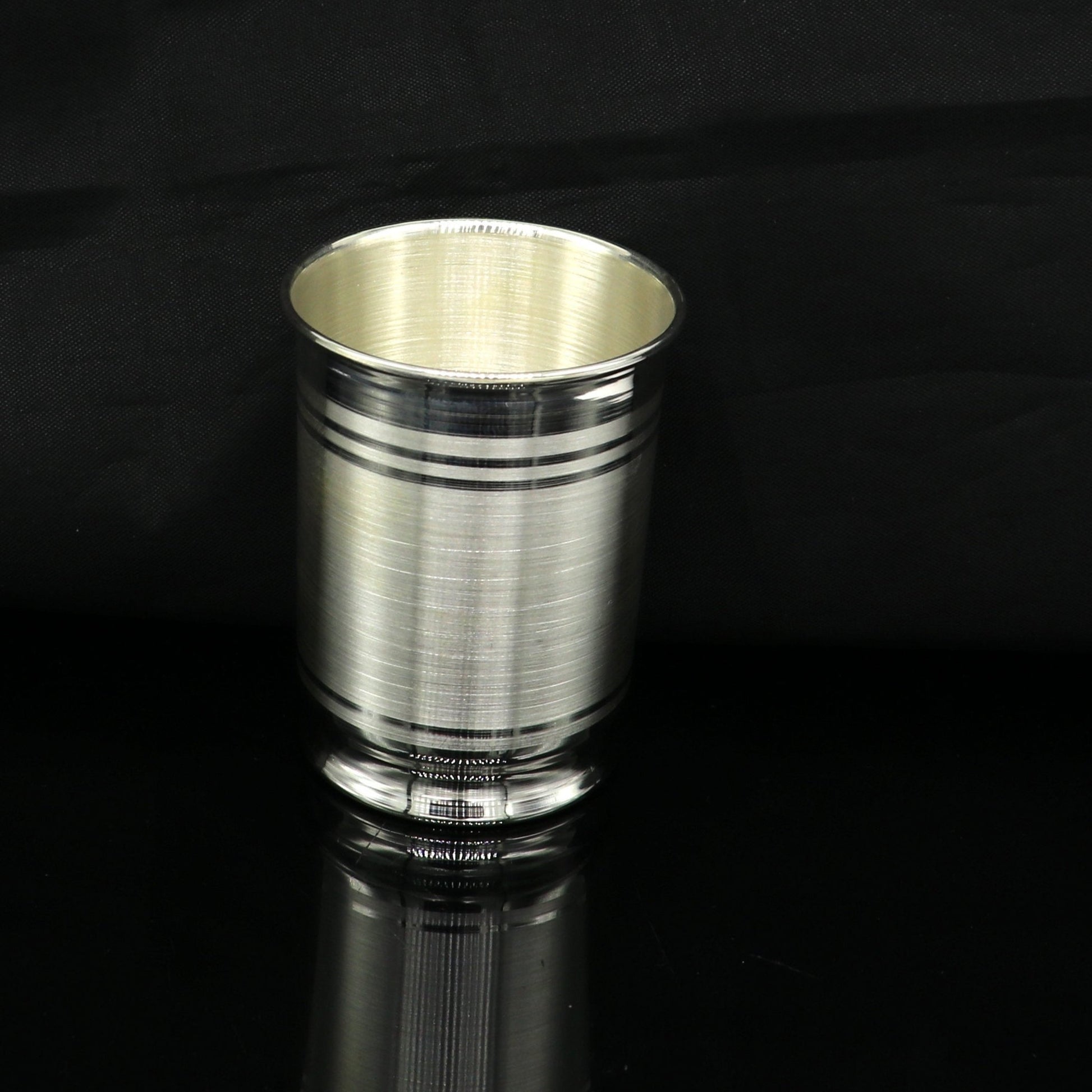 Handmade 999 fine silver water and milk glass tumbler and silver flask by Tribal Ornaments with baby and kids silver utensils.