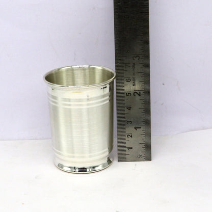 Handmade 999 fine silver water and milk glass tumbler, silver flask, and baby silver utensils from Tribal Ornaments.