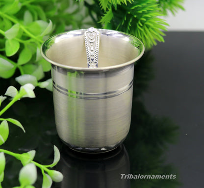 Handmade 999 fine silver water and milk tumbler, silver flask, and kids silver utensils set by TRIBAL ORNAMENTS for healthy living.