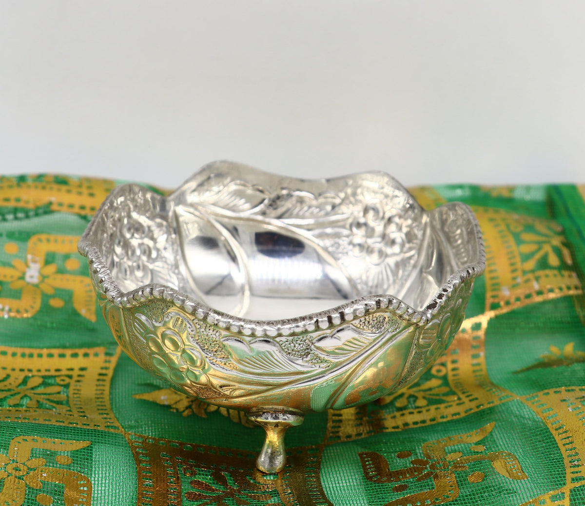 Silver vintage worshipping puja bowl with intricate design, ideal for prasadam or idols like Krishna, by TRIBAL ORNAMENTS.