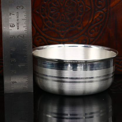 999 fine silver water glass, bowl, spoon, and baby food utensils by TRIBAL ORNAMENTS, featuring intricate silver craftsmanship.