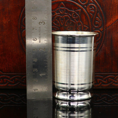 Fine silver water and milk glass, bowl, and baby food utensils set by Tribal Ornaments, includes spoon and tumblers.
