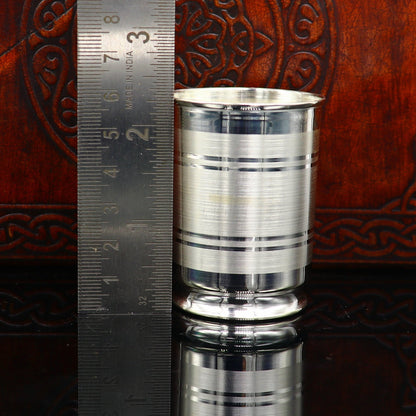 Fine silver water and milk glass, bowl, tumbler, spoon, and utensils from TRIBAL ORNAMENTS, crafted in 999 silver.