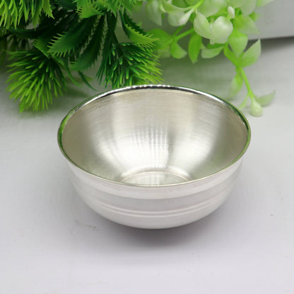 Handmade 999 fine solid silver bowl with intricate designs, ideal for baby gift, puja utensils, and silver vessel from India.