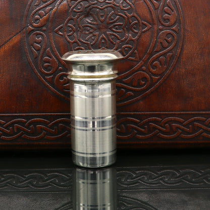 Handmade 999 fine solid silver pill and tobacco box with intricate tribal ornaments, compact personal storage for men's accessories.