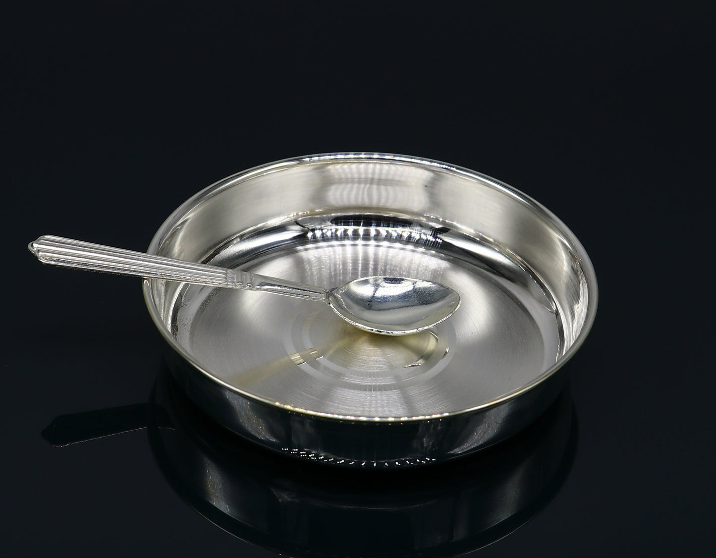 Solid silver handmade tray for baby food serving, ideal for rice ceremony, with intricate tribal design by TRIBAL ORNAMENTS.