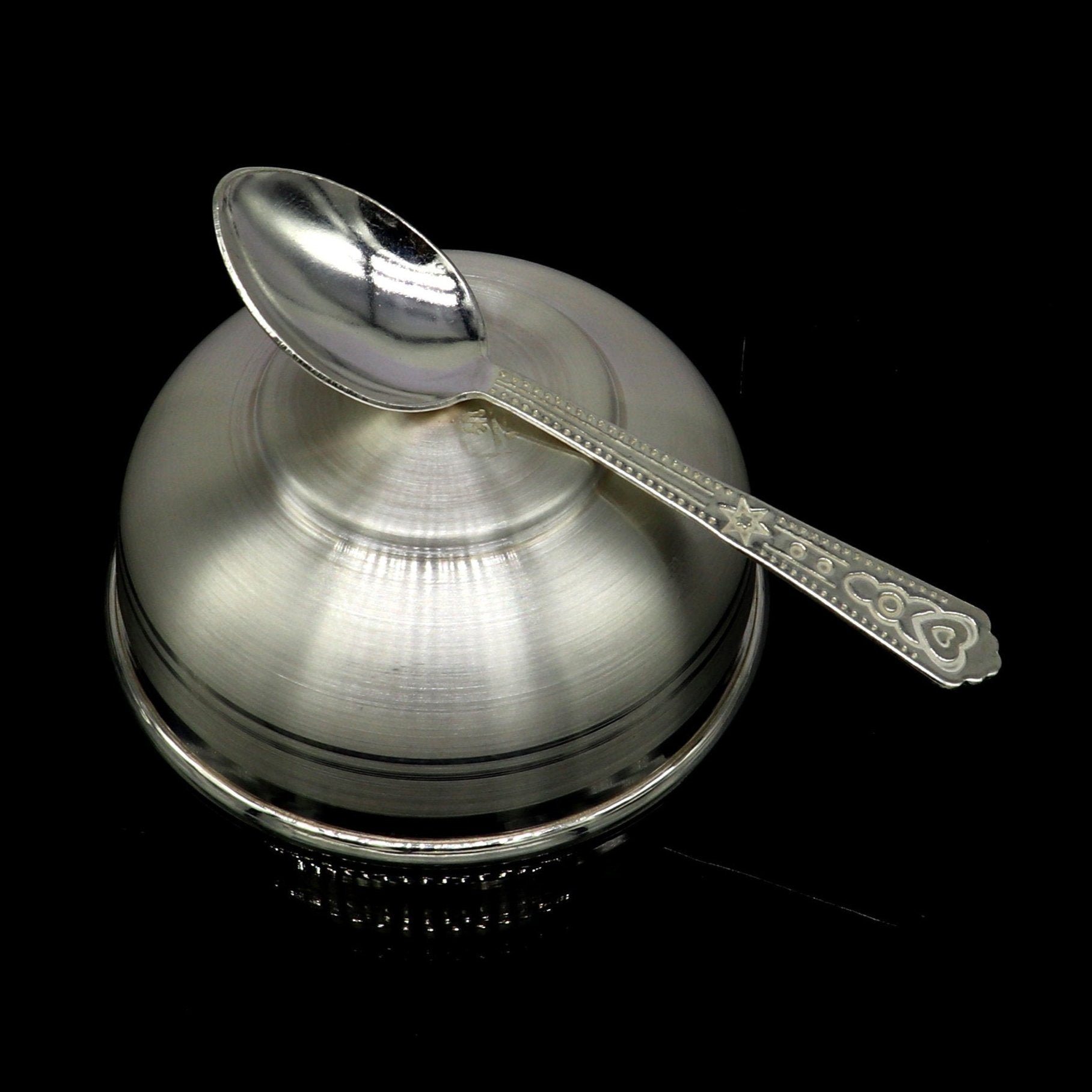 Handmade 999 pure fine silver utensils including a silver vessel, accessories, puja art, and a baby bowl set by Tribal Ornaments.