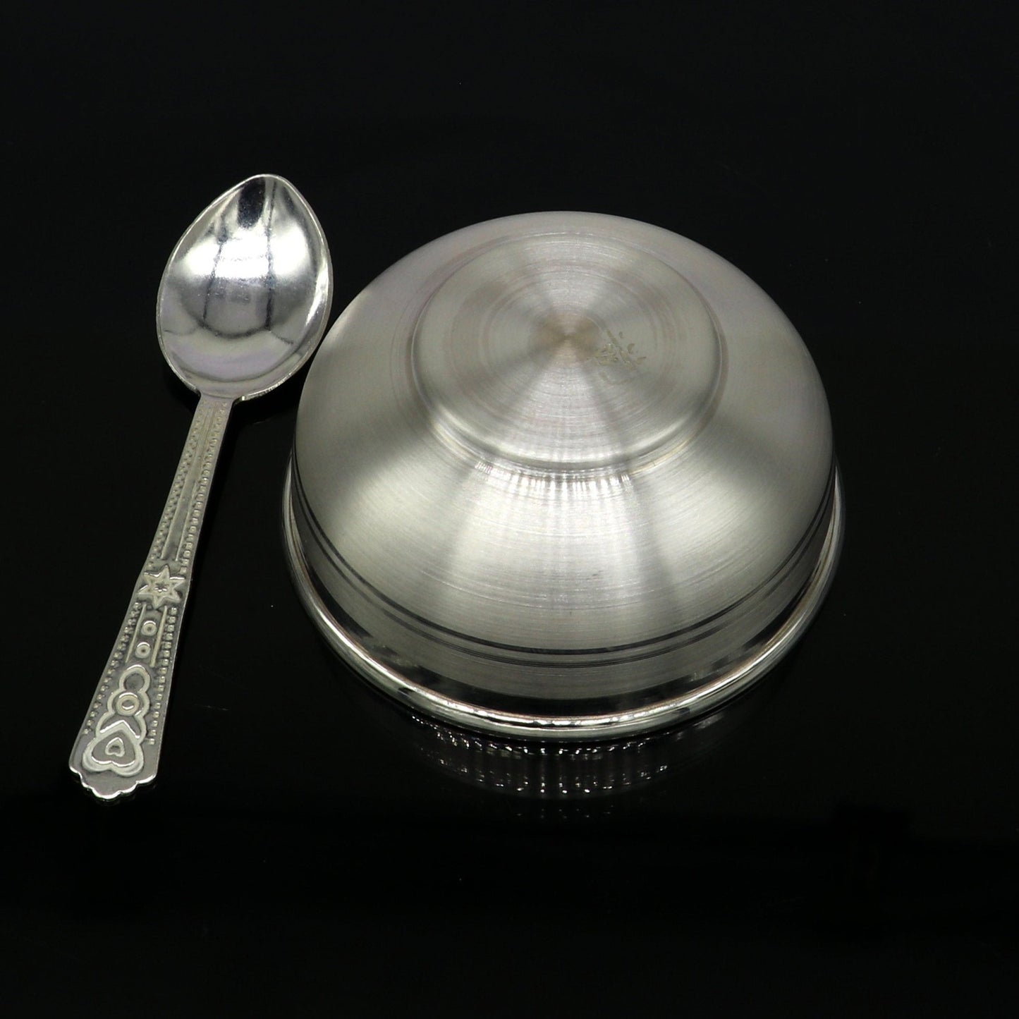 Handmade 999 pure fine silver utensils, including vessels and baby bowls, from TRIBAL ORNAMENTS for puja and decorative use.