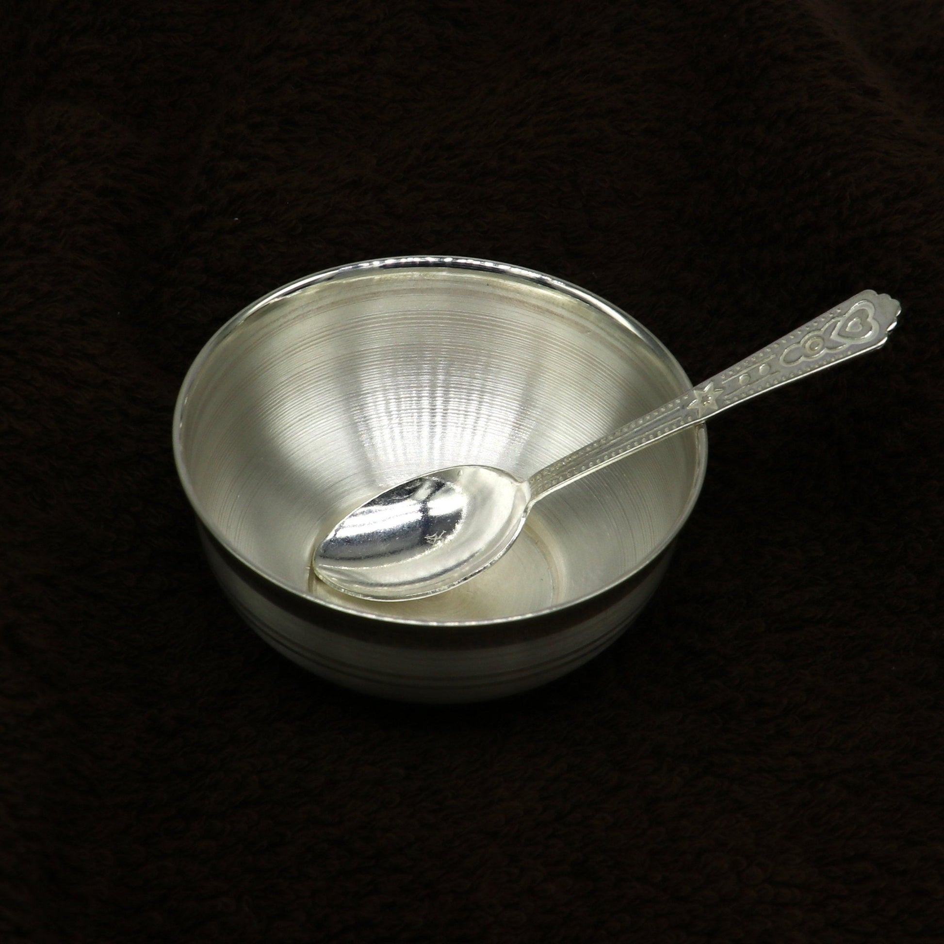 Handmade 999 pure fine silver utensils and baby bowl set, featuring silver vessels and accessories for puja and traditional use.