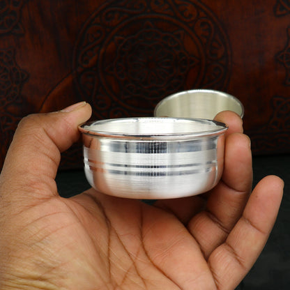 Pure silver combo bowl and water tumbler set by TRIBAL ORNAMENTS, featuring silver baby utensils and food serving vessels.