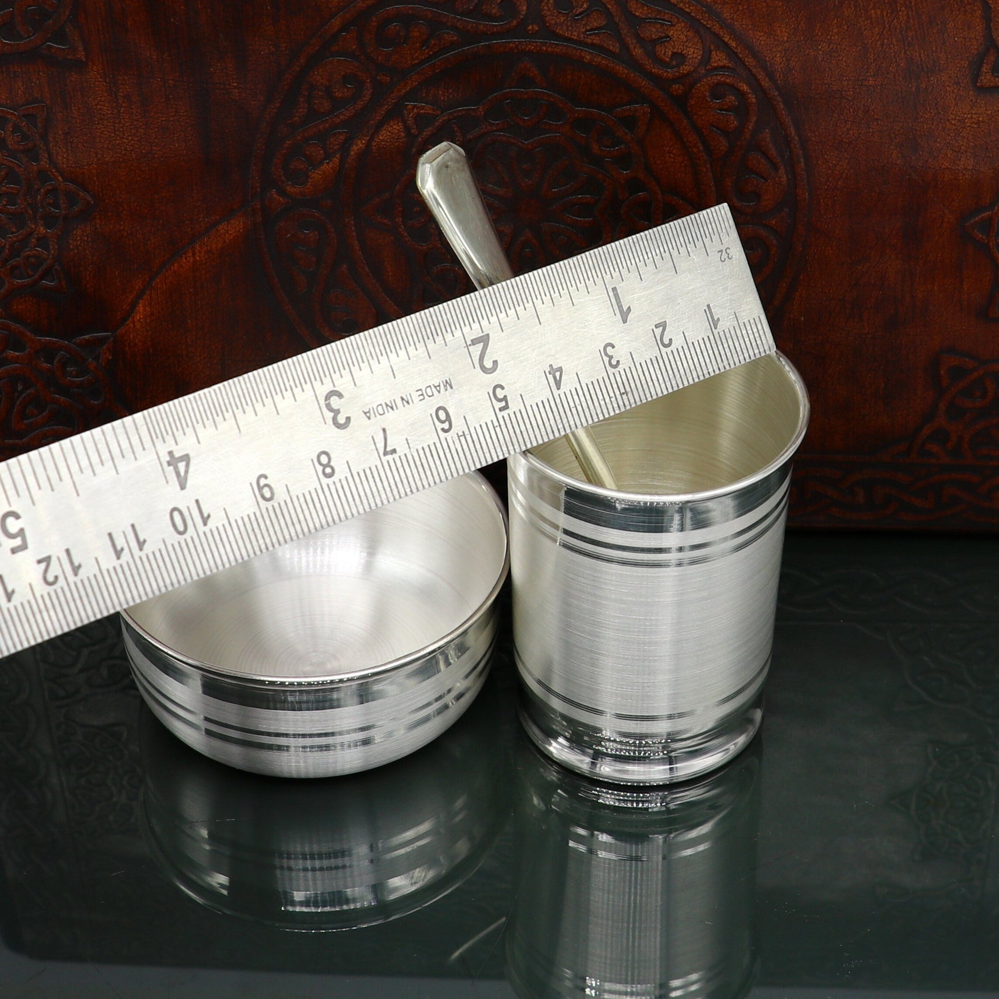 Pure silver combo bowl and water/milk tumbler set by Tribal Ornaments, featuring silver baby utensils and gifting silver kitchenware.
