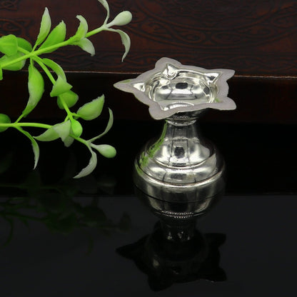 Handmade 999 pure silver oil lamp, elegant silver diya for home temple, silver puja utensils, deepak, and vessels by TRIBAL ORNAMENTS.
