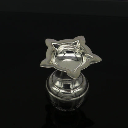 Handmade 999 pure silver oil lamp with intricate design, ideal for home temple puja, crafted by Tribal Ornaments.