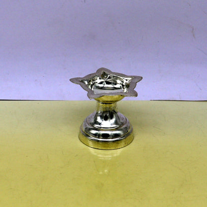 Handmade 999 pure silver oil lamp with intricate design, ideal for home temple, silver diya, and puja rituals.