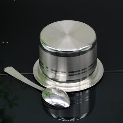 Handmade 999 pure silver baby feeding set with bowl and spoon, featuring traditional tribal ornament design and solid silver vessels.