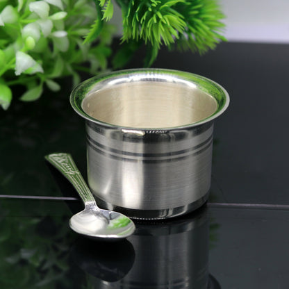 Handmade 999 pure silver baby feeding set with bowl and spoon by Tribal Ornaments, featuring traditional silver vessels and utensils.