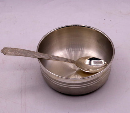 Handmade sterling silver bowl and spoon set with antibacterial properties, showcasing intricate tribal design and polished finish.