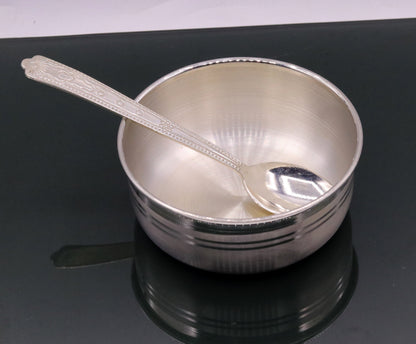 Handmade sterling silver bowl and spoon set with antibacterial properties, crafted by TRIBAL ORNAMENTS, showcasing intricate design.