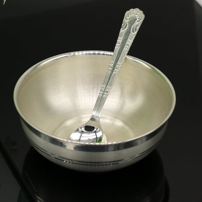 Handmade 999 pure sterling silver bowl and spoon from Tribal Ornaments, showcasing intricate craftsmanship and antibacterial silver properties.
