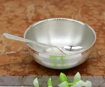 Handmade 999 pure sterling silver bowl and spoon by TRIBAL ORNAMENTS, featuring antibacterial properties and traditional craftsmanship.