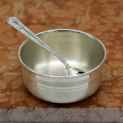 Handmade 999 pure sterling silver bowl and spoon by TRIBAL ORNAMENTS, featuring antibacterial properties and elegant craftsmanship.