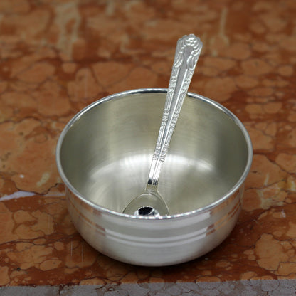 Handmade 999 pure sterling silver bowl and spoon by TRIBAL ORNAMENTS, featuring antibacterial properties and intricate craftsmanship.