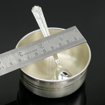 Handmade 999 pure sterling silver bowl and spoon by TRIBAL ORNAMENTS, featuring antibacterial properties and traditional craftsmanship.