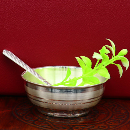 Handmade 999 pure sterling silver baby bowl and spoon set with a sleek silver vessel for healthy serving food.