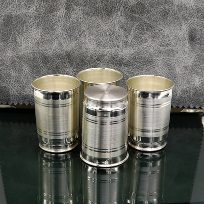 Handmade 999 silver baby glass set with tumblers, suitable for water, milk, wine, and vodka, featuring intricate tribal designs.