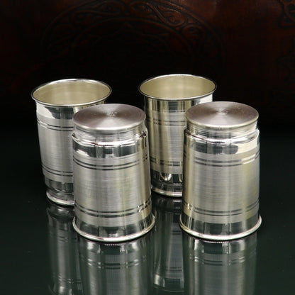 Handmade 999 silver baby glass set with tumblers for water, milk, vodka, and wine, featuring intricate tribal ornament designs.