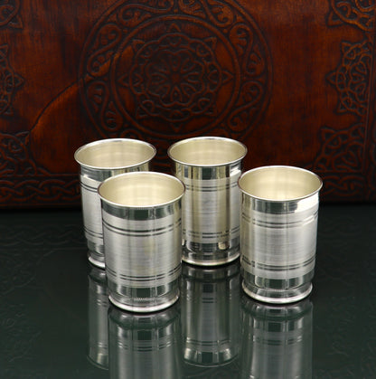 Handmade 999 silver baby glass set including water and milk tumblers, with silver vodka and wine glasses, by Tribal Ornaments.