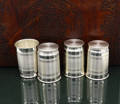 Handmade 999 silver baby glass set including water and milk tumblers, with wine and vodka glasses, by TRIBAL ORNAMENTS.