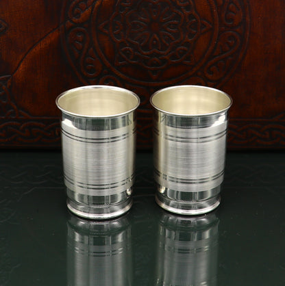 Handmade 999 silver baby glass set with tumblers for water and milk, featuring elegant design and baby feeding utensils.