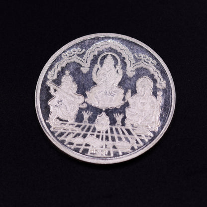 Silver coin featuring Indian idols of Lord Ganesha, Laxmi, and Saraswati, 20 grams, collectible coin by Tribal Ornaments