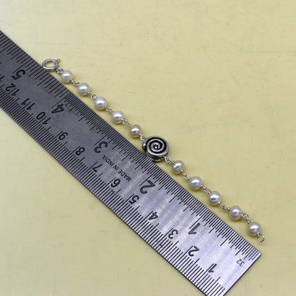 Sterling silver handmade baby bracelet with natural white pearl beads, crafted by TRIBAL ORNAMENTS for kids jewelry.