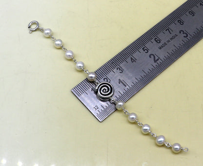 Sterling silver handmade baby bracelet with natural white pearl beads, perfect for kids jewelry by TRIBAL ORNAMENTS.