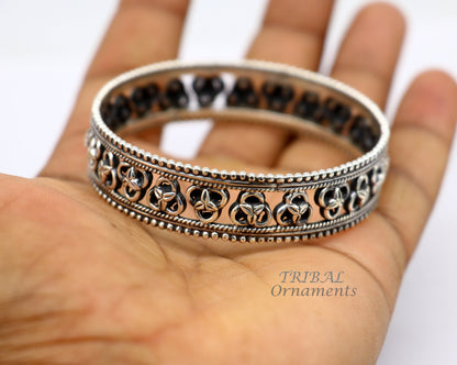 Sterling silver flower design bangle bracelet by TRIBAL ORNAMENTS, showcasing intricate tribal and ethnic jewelry craftsmanship.