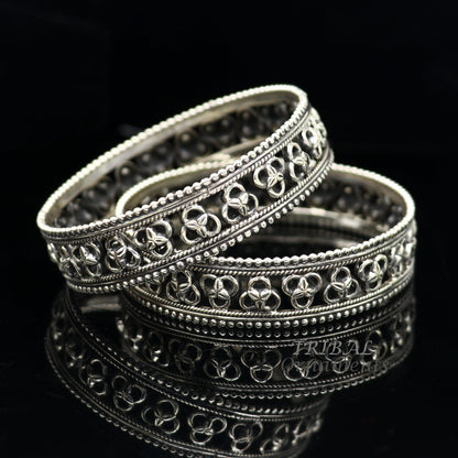 925 sterling silver flower design bangle bracelet by TRIBAL ORNAMENTS, featuring intricate tribal and ethnic jewelry style.