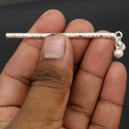 Handmade solid sterling silver Krishna flute idol with intricate design, featuring a silver bansuri and detailed puja art.