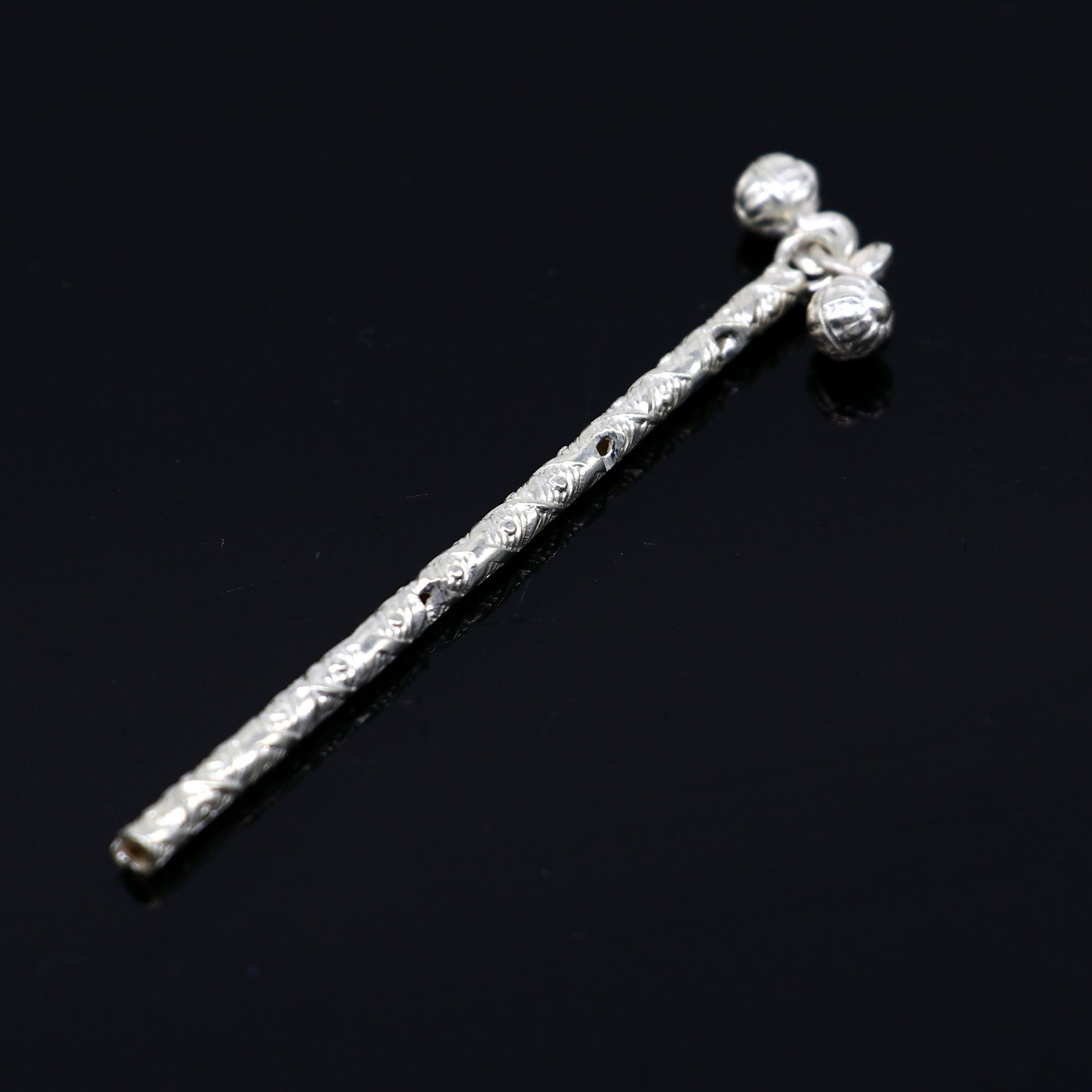 Solid sterling silver handmade Krishna flute idol with detailed design, featuring a silver bansuri for puja and decorative art.