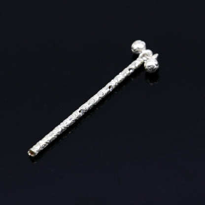 Handmade sterling silver Krishna flute idol with intricate design, featuring a silver bansuri and detailed puja art.