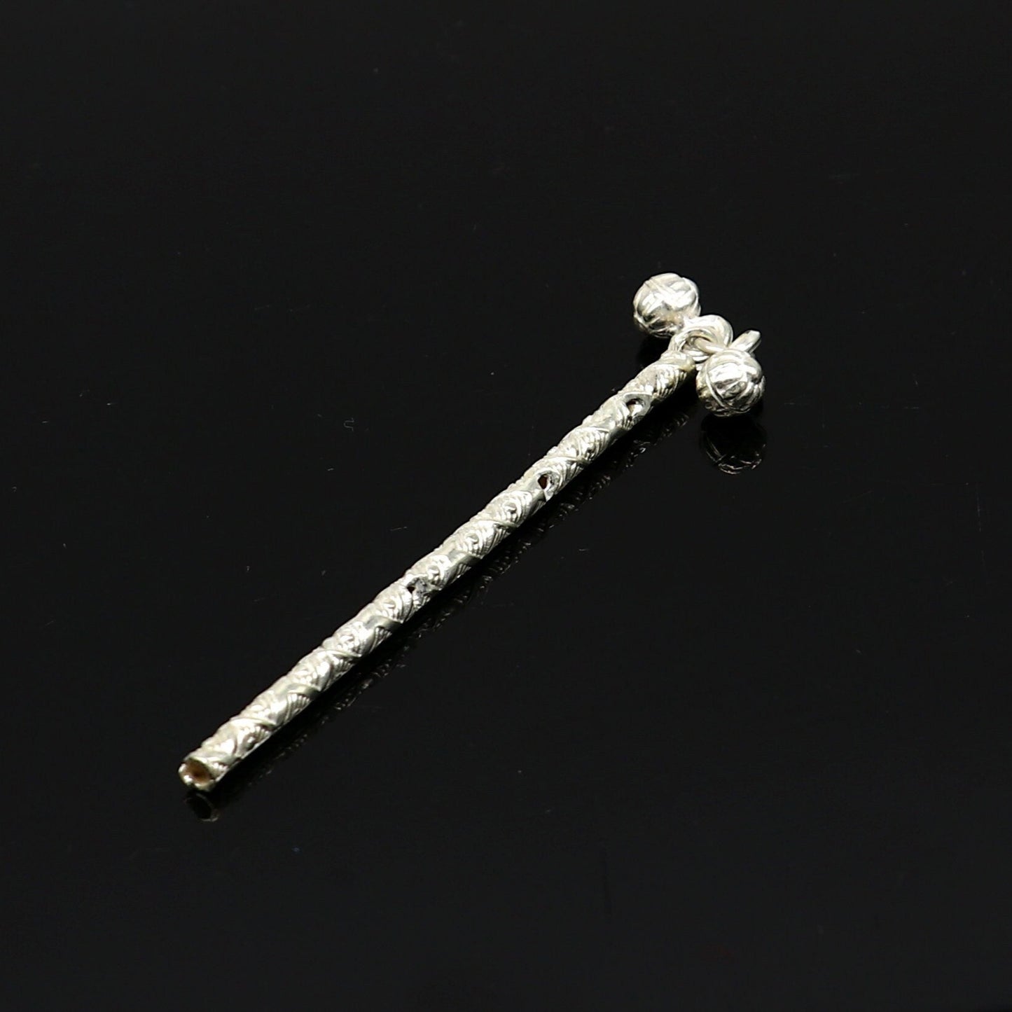 Sterling silver handmade Krishna flute idol with detailed design, featuring a traditional bansuri and puja art from Tribal Ornaments.