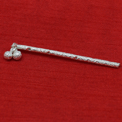 Handmade solid sterling silver Krishna flute with intricate design, featuring a small idol of Laddu Gopala and traditional puja art.