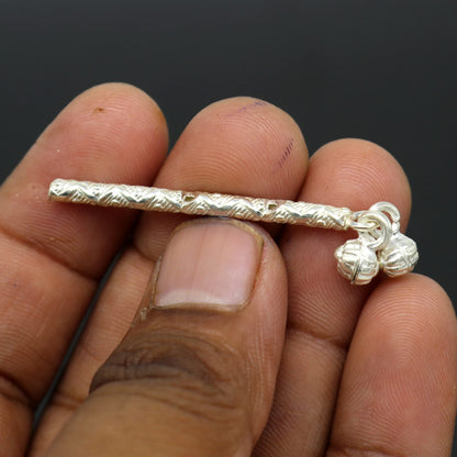 Handmade solid sterling silver Krishna idol with flute, featuring detailed puja art and traditional design, crafted by TRIBAL ORNAMENTS.