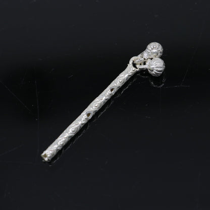 Handmade sterling silver Krishna flute idol with detailed design, featuring a laddu Gopala figure and traditional puja art.