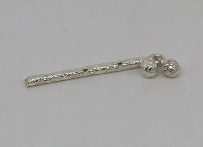 Handmade solid sterling silver Krishna flute idol with detailed design, featuring a silver bansuri and Laddu Gopala motif for puja art.