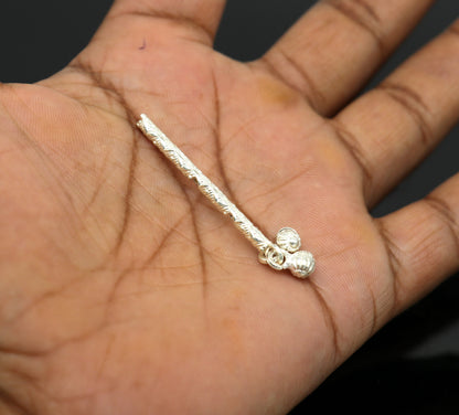 Solid sterling silver handmade Krishna flute idol with detailed puja art, featuring a silver bansuri and Laddu Gopala design.