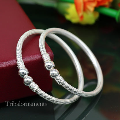 Sterling silver bangle bracelet with tribal design, customized jewelry by TRIBAL ORNAMENTS, perfect for traditional occasions.