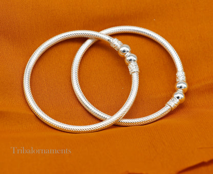Sterling silver tribal bangle bracelet with intricate custom design, perfect as a traditional Indian jewelry accessory.